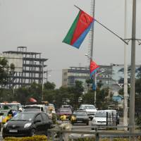 Traffic is seen in Addis Ababa on July 13. African and South Asian nations could miss greenhouse gas emissions targets unless wealthy countries stop using them as dumping grounds for millions of older cars, a study has warned. Carbon emissions goals at risk as 'clunker' cars flood Africa and South Asia
