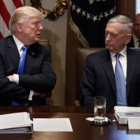 U.S. Secretary of Defense Jim Mattis listens as President Donald Trump speaks during a Cabinet meeting at the White House in December 2017. As Trump confounds, Jim Mattis seen as quiet champion among NATO allies