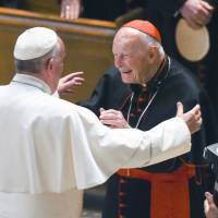 Pope Francis reaches out to hug Cardinal Archbishop emeritus Theodore McCarrick after the Midday Prayer of the Divine with more than 300 U.S. bishops at the Cathedral of St. Matthew the Apostle in Washington on Sept. 23, 2015. Pope accepts resignation of McCarrick after sex abuse claims