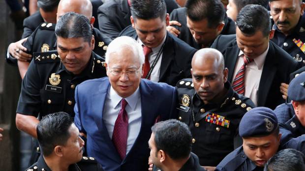 Former Malaysian prime minister Najib Razak arrives in court in Kuala Lumpur on Wednesday 2018. Former Malaysian leader Najib Razak pleads not guilty to corruption charges in 1MDB case