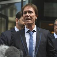 Singer Cliff Richard speaks to the media outside the Rolls Building, where he was awarded more than £200,000 sterling in damages after winning his High Court privacy battle against the BBC over its coverage of a South Yorkshire Police raid in August 2014 on his home in Sunningdale, Berkshire following a child sex assault allegation, Wednesday in London. Singer Cliff Richard wins BBC privacy case, sparking media alarm