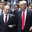 U.S. President Donald Trump and Russian President Vladimir Putin talk during the family photo session of the APEC summit in Danang, Vietnam, last November.