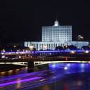 A vessel plies the Moskva River near the Russian White House, headquarters of the federal government, in Moscow Monday.
