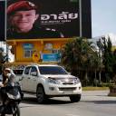 A board showing "R.I.P. Samarn Gunan, A hero who sacrificed his life at Tham Luang", is seen on Saturday in Chiang Rai, Thailand. Gunan died during the rescue mission to save 12 soccer boys and their coach from inside the Tham Luang cave complex.