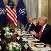 U.S. President Donald Trump holds a breakfast meeting with NATO Secretary-General Jens Stoltenberg (left) at the NATO Summit in Brussels on Wednesday. Trump and Merkel exchange barbs in showdown over Russia pipeline at start of NATO summit