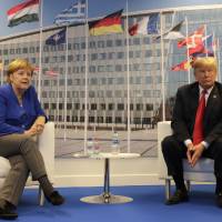 German Chancellor Angela Merkel and U.S. President Donald Trump pose for a photograph prior to a bilateral meeting on the sidelines of a summit of heads of state and government at NATO headquarters in Brussels Wednesday. NATO leaders gathered in Brussels for a two-day summit to discuss Russia, Iraq and their mission in Afghanistan. Trump stuns NATO with demand to double defense spending to 4%, calls gas-reliant Germany 'captive' of Russia