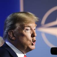 U.S. President Donald Trump addresses a news conference after a summit of heads of state and government at NATO headquarters in Brussels on July 12, 2018. 'You, Angela': Trump claims victory after forcing NATO leaders into crisis talks with tirade