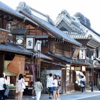 Traditional Japanese warehouses stand in a row on the main street of Kawagoe, Saitama Prefecture. Kawagoe: From Edo standout to tourist draw