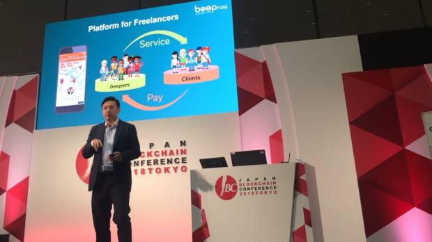 Alex Tsai, CEO of Osaka-based startup Beepnow, explains his blockchain-based business at the Japan Blockchain Conference in Tokyo on June 27. Tokyo blockchain conference looks to uses of technology beyond headline-grabbing cryptocurrencies