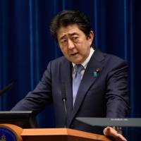 Prime Minister Shinzo Abe holds a news conference at the prime minister’s official residence in Tokyo on Friday. Abe will compile extra budget if needed over rain disasters