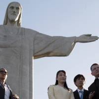 Japan’s Princess Mako talks to Monsignor Sergio Costa Couto as she visits the Christ the Redeemer statue in Rio de Janeiro Wednesday. The princess is in Brazil to take part in celebrations marking the 110th anniversary of Japanese immigration to Latin America’s largest country. Princess Mako visits Brazil, home of largest Japanese diaspora, to celebrate 110 years of immigration