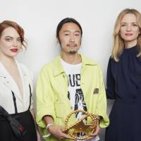 Doublet designer Masayuki Ino (center) with actress Emma Stone (left) and Delphine Arnault, director and executive vice president of Louis Vuitton The fashion industry welcomes a Doublet dose of parody