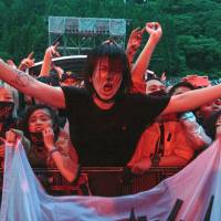 Front row: Fans get ready to watch Skrillex on the main Green Stage at Fuji Rock. More hip-hop, more J-pop and a typhoon: Fuji Rock 2018 was full of new energy