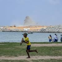 Sri Lankans hang out at the site of Colombo Port City, developed by China Harbour Engineering Co. Sri Lanka’s interest payments to China come to $11 billion a year. China's silk road isn't turning out to be smooth