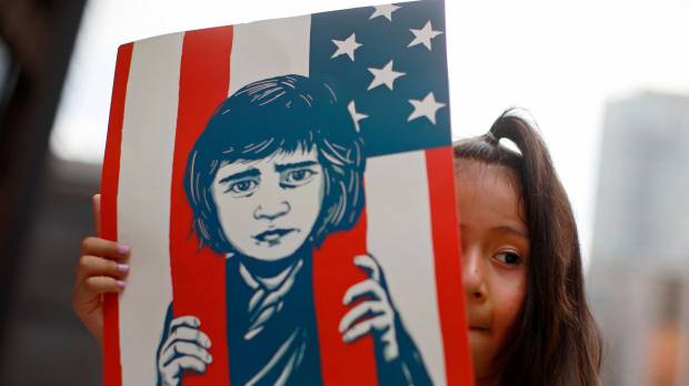 Pots and kettles: A girl takes part in a protest in Chicago last month against U.S. immigration policies that led to the separation of thousands of migrant parents from their children. The situation in the U.S. now shouldn’t distract activists from what is happening in immigration detention centers in Japan, for example. What about we stop it with the 'whataboutism'?