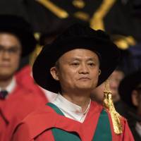 Alibaba Executive Chairman Jack Ma receives an honorary doctoral degree at the University of Hong Kong on May 18. China and Hong Kong have five of the top 10 institutions of higher education in Asia. Japan's universities need more global ties