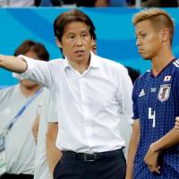 Japan manager Akira Nishino, seen instructing Kesiuke Honda on the sideline during Monday’s World Cup match against Belgium in Rostov-on-Don, Russia, guided the team into the round of 16. Despite disappointing departure, Samurai Blue exceeded expectations at World Cup