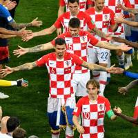 The Croatian players are congratulated by the French team following their match on Sunday in Moscow. Croatia left heartbroken yet proud after loss to France in World Cup final