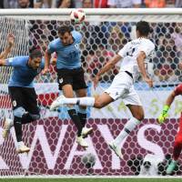 France’s Raphael Varane (second from right) scores with a header against Uruguay in their World Cup quarterfinal in Nizhny Novgorod, Russia, on Friday. AFP-JIJI France beats Uruguay to reaches World Cup semifinals