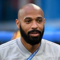 Belgium assistant coach Thierry Henry watches the France-Belgium semifinal at the World Cup on July 10 in St. Petersburg, Russia. Thierry Henry quits TV analyst gig to focus on coaching