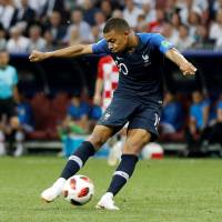 France’s Kylian Mbappe scores a goal in the World Cup final on July 15. World Cup star Kylian Mbappe played through back injury in final two games