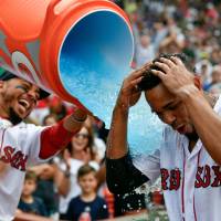 Red Sox outfielder Mookie Betts pours Gatorade on Xander Bogaerts after their walk-off win over the Blue jays on Saturday at Fenway Park. Bogaerts lifted the Red Sox with a 10th-inning home run. Xander Bogaerts lifts Red Sox with walk-off grand slam