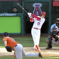 The Angels’ Shohei Ohtani connects on a double against Astros starter Justin Verlander on Saturday in Anaheim, California. Ohtani's hits not enough for Halos