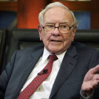 Berkshire Hathaway Chairman and CEO Warren Buffett speaks during an interview in Omaha, Nebrask, in May with Liz Claman on Fox Business Network’s “Countdown to the Closing Bell.” Buffett says stocks remain attractive investments even at today’s high prices when compared to bonds or real estate. Warren Buffett says firm buying back own stock, Apple shares