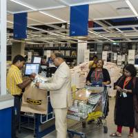 Customers check out at Ikea’s first store in India, which opened Wednesday in Hitech City on the outskirts of Hyderabad. How Ikea caters to local tastes around the world