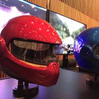 Prototype smart helmets made by Japan Display Inc. are exhibited on Wednesday in Tokyo’s Akihabara district. Japan Display plans foray into consumer markets with smart motorcycle helmets and mirrors