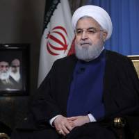 In this photo released by official website of the office of the Iranian Presidency, President Hassan Rouhani addresses the nation in a televised speech in Tehran Monday. Rouhani struck a hard line Monday as the U.S. restored some sanctions that had been lifted under the 2015 nuclear deal. Once-eased U.S. economic sanctions against Iran back in effect