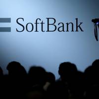 The logo of SoftBank Group Corp. is seen at the SoftBank World 2017 conference in Tokyo last year. SoftBank's Masayoshi Son in his own words — all 303,513 of them