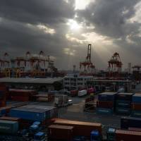 A shipping terminal in Yokohama is seen in April. Japan’s current account surplus increased in the first half of 2018 on the back of foreign investments. Japan's current account surplus rose in first half of 2018 on foreign investments