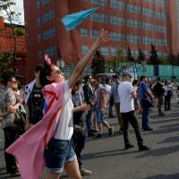 A youth releases a paper plane, symbol of the Telegram messenger, during a rally in against a court decision to block the messenger because it violated Russian regulations, in Moscow May 13. Russia said failing in bid to tap more precise tech to block Telegram messenger services