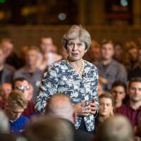 British Prime Minister Theresa May speaks during a question and answer session at Reece Group, an engineering firm in Newcastle, U.K., on July 23. Japan offers clue for British banks' future in Europe after Brexit, U.K. says