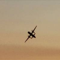 This screen grab from footage filmed by a bystander on Aug. 10 at Chambers Bay Park and Golf Course in University Place, Washington, shows a passenger airplane that was stolen from the Seattle-Tacoma airport. Seattle airplane theft shows potential dangers from airline workers
