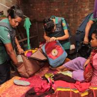 Police search a house during a drug raid in Dhaka on June 4. Arrested and killed: Inside the Bangladesh prime minister's war on drugs