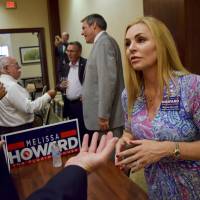 Melissa Howard, a Florida House candidate who falsely claimed she had a college degree and has now dropped out of the race, meets voters in Lakewood Ranch on July 17. Florida's famed weirdness creeping into political races