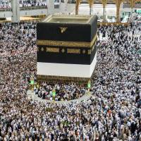 Muslim worshippers walk around the Kaaba, Islam’s holiest shrine, at the Grand Mosque in Saudi Arabia’s holy city of Mecca on Saturday. Over 2 million Muslims begin annual hajj pilgrimage