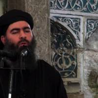 An image grab from a propaganda video released by al-Furqan Media in 2014 allegedly shows the leader of the Islamic State (IS) jihadist group, Abu Bakr al-Baghdadi, aka Caliph Ibrahim, adressing Muslim worshippers at a mosque in the militant-held northern Iraqi city of Mosul. Al-Baghdadi called on Muslims to wage “jihad” in a purported new audio recording released Wednesday. Islamic State leader resurfaces in purported audio, first in 11 months, urges ranks to 'persevere'