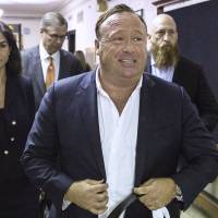 “Infowars” host Alex Jones arrives at the Travis County Courthouse in Austin, Texas, in 2017. Conspiracy theorist Alex Jones booted from YouTube, Facebook, Apple and Spotify