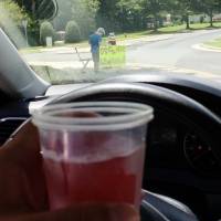 James Castellano of Monroe, North Carolina, bought this drink from the boy in the background in Monroe last Saturday. The 9-year-old lemonade vendor was robbed of $17 at gunpoint the same day. Arrest made in armed stickup of lemonade stand in North Carolina