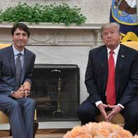 U.S. President Donald Trump and Canadian Prime Minister Justin Trudeau look on during their meeting at the White House in Washington on October 11, 2017 . Following U.S.-Mexico deal, Washington and Ottawa set for talks to revise NAFTA