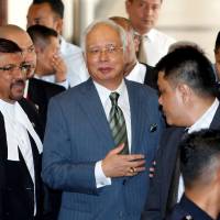 Malaysia’s former Prime Minister Najib Razak walks out of a courtroom in Kuala Lumpur on Wednesday. Former Malaysian Prime Minister Najib Razak fails in media gag bid ahead of graft trial