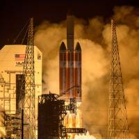 This photo released by NASA shows the Delta IV Heavy rocket with the Parker Solar Probe onboard launching from the Mobile Service Tower early Sunday morning at Cape Canaveral Air Force Station in Florida. NASA's Parker Solar Probe launched toward sun for closest-ever look