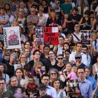 An estimated 4000 protesters rally at Sydney Town Hall on Feb. 8, 2016, to demonstrate their opposition to Australia’s deportation and detention of asylum seeker children to offshore processing centers on Manus Island and Nauru. New Zealand PM Jacinda Ardern repeats offer to resettle refugees held by Australia