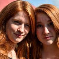 Two women pose during the “Red Love Festival,” the first festival dedicated to redheads, on Saturday in Chateaugiron, near Rennes, western France. 'Red love': Hundreds of redheads gather in western France