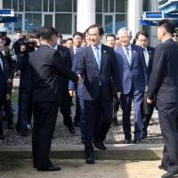 South Korean Unification Minister Cho Myoung-gyon crosses the concrete border to attend a meeting with his North Korean counterpart Ri Son Gwon at the truce village of Panmunjom inside the demilitarized zone on Monday. Rival Korea leaders plan September meeting in Pyongyang