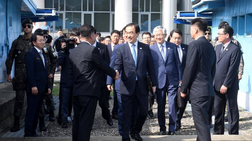 South Korean Unification Minister Cho Myoung-gyon crosses the concrete border to attend a meeting with his North Korean counterpart Ri Son Gwon at the truce village of Panmunjom inside the demilitarized zone on Monday. Rival Korea leaders plan September meeting in Pyongyang