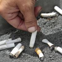 A smoker extinguishes a cigarette in an ash tray in Sacramento, California, in 2012. If you quit smoking and gain weight, it may seem like you’re trading one set of health problems for another. But a new U.S. study released on Wednesday finds you’re still better off in the long run. Smokers better off quitting, even with weight gain, extensive U.S. study finds